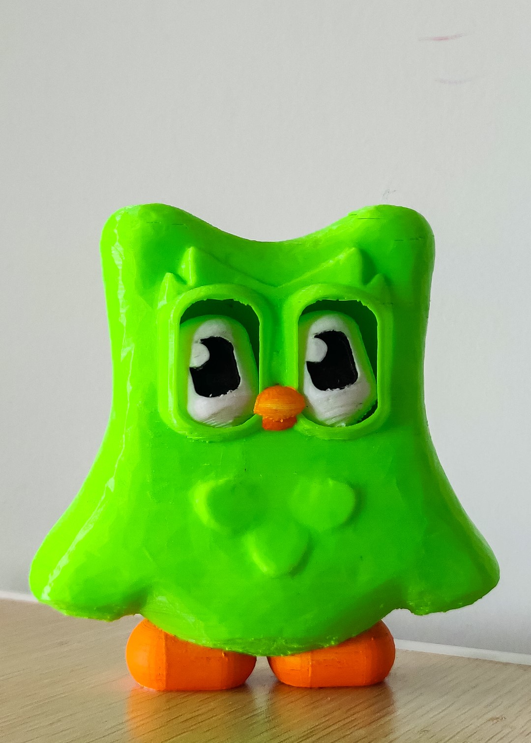 Our Duolingo print is sitting pretty with calm black eyes, good job on keeping your streak up! Duo is proud.